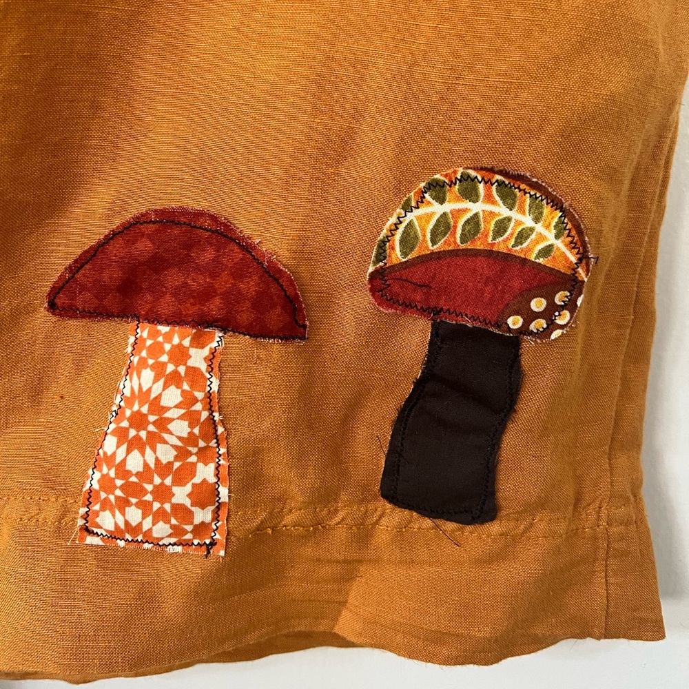 Maeve mustered short romper with mushroom apliqué